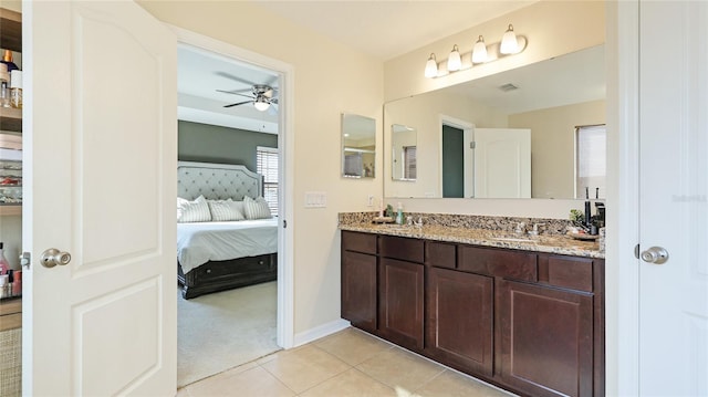 bathroom featuring ceiling fan, tile patterned flooring, and vanity