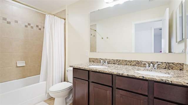 full bathroom with shower / bath combination with curtain, vanity, and toilet