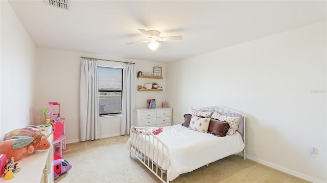 bedroom featuring ceiling fan and light carpet