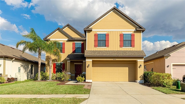 view of front facade with a front lawn and a garage