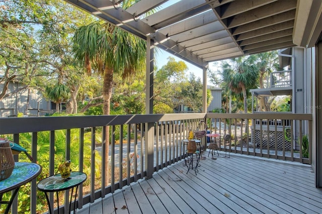 wooden terrace with a pergola