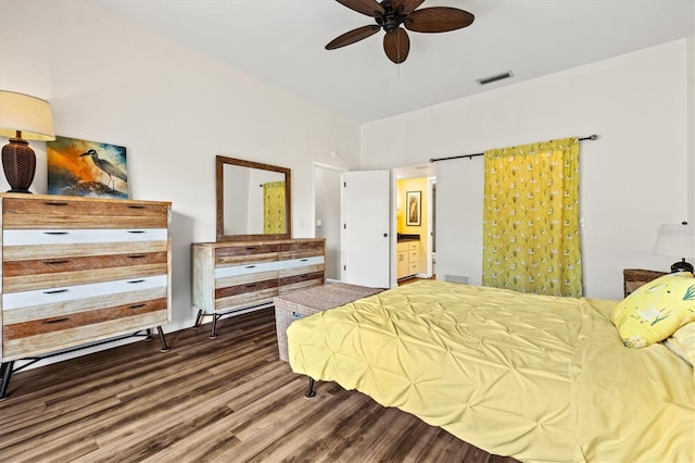 bedroom featuring wood-type flooring and ensuite bath