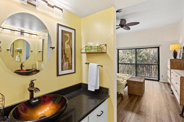 bathroom featuring hardwood / wood-style flooring, vanity, and ceiling fan