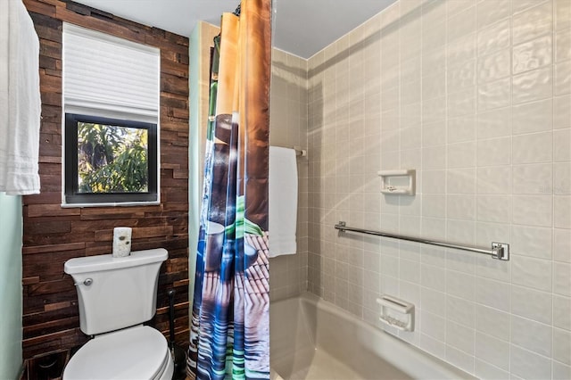 bathroom with toilet and shower / bath combo with shower curtain