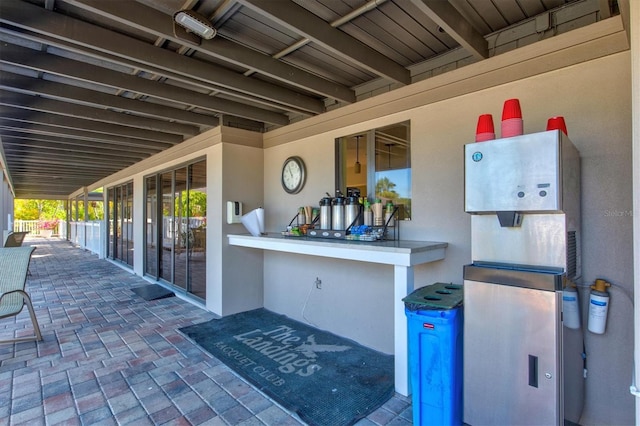 view of patio featuring an outdoor bar