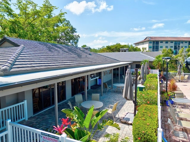 back of house with a patio area