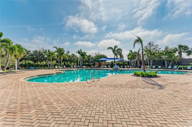 community pool with a patio area