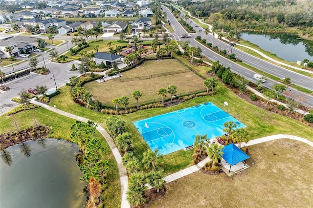 aerial view featuring a residential view and a water view