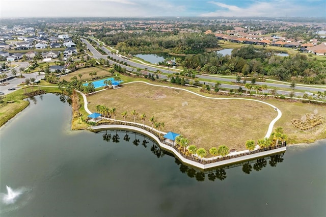 drone / aerial view featuring a water view and a residential view