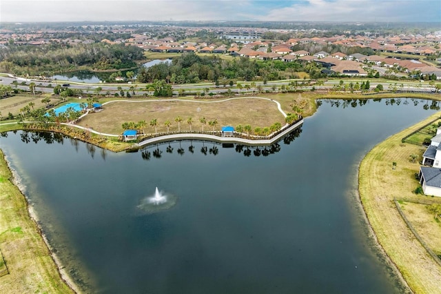 birds eye view of property featuring a water view and a residential view