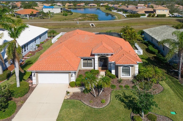 birds eye view of property featuring a water view