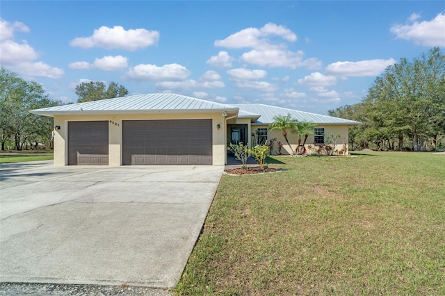 view of front facade featuring a garage and a front lawn