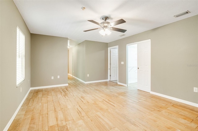 unfurnished room with light hardwood / wood-style floors and ceiling fan