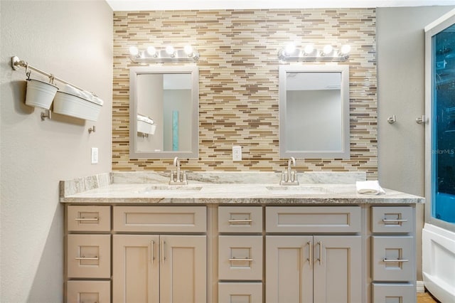 bathroom with vanity and decorative backsplash