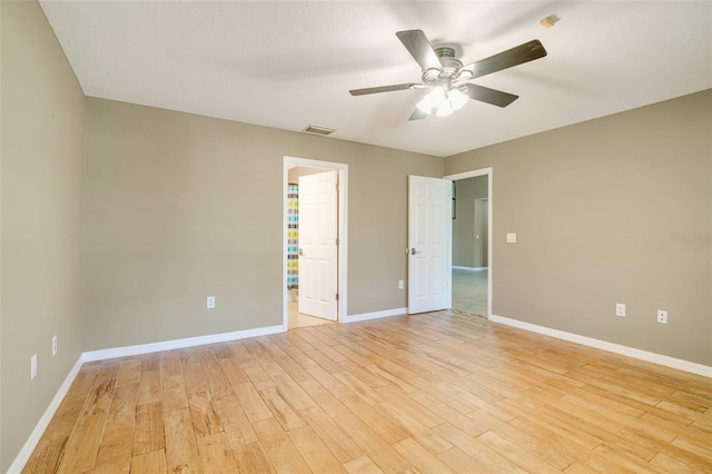 unfurnished room featuring ceiling fan and light wood-type flooring