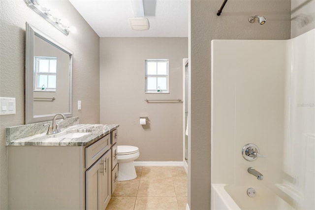 full bathroom featuring vanity, shower / washtub combination, tile patterned floors, and toilet