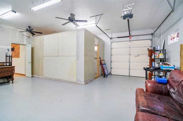 garage with a garage door opener and ceiling fan