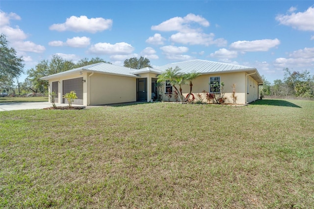 single story home featuring a garage and a front lawn