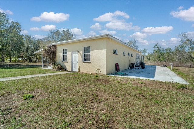 exterior space featuring a patio and a front yard