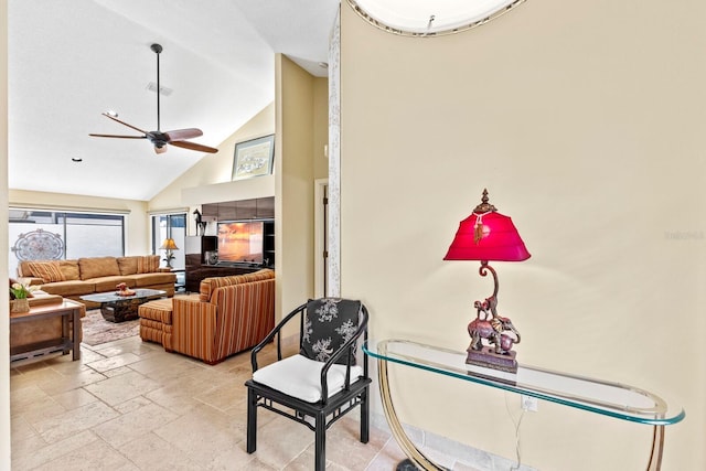 living room with high vaulted ceiling and ceiling fan