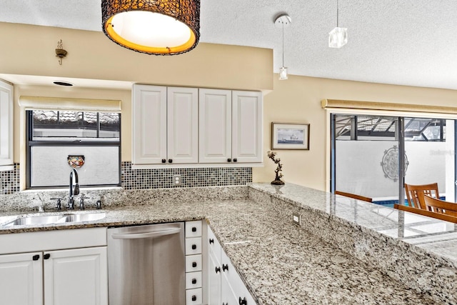 kitchen with white cabinets, sink, and dishwasher