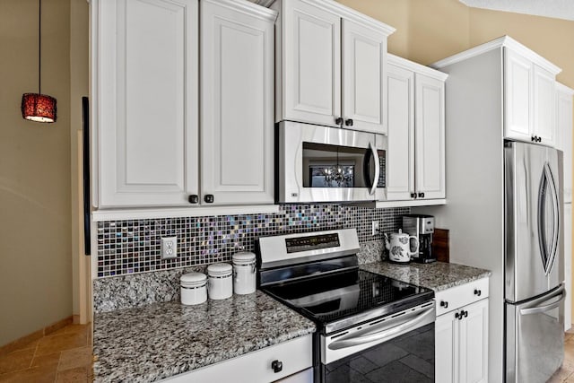 kitchen featuring white cabinetry, appliances with stainless steel finishes, and light stone countertops