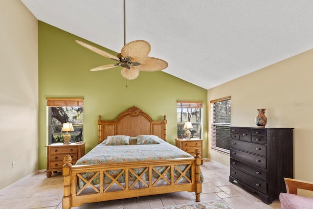 bedroom with ceiling fan and high vaulted ceiling