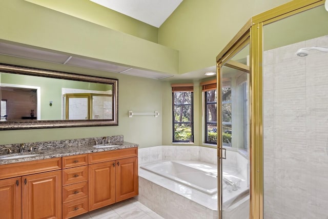 bathroom with tile patterned floors, vanity, and independent shower and bath