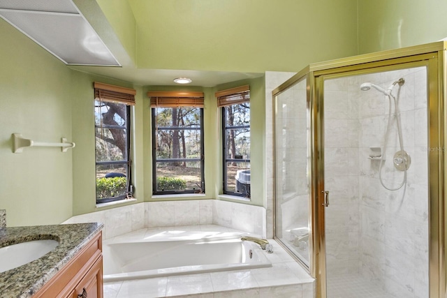 bathroom with vanity and plus walk in shower