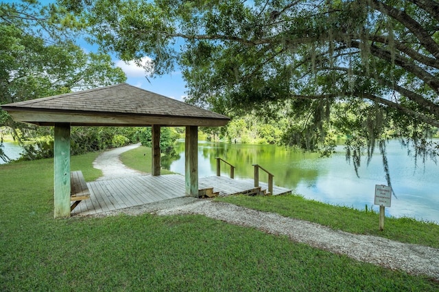 dock area with a yard, a gazebo, and a water view