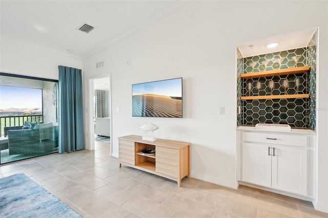 unfurnished living room featuring light tile patterned floors