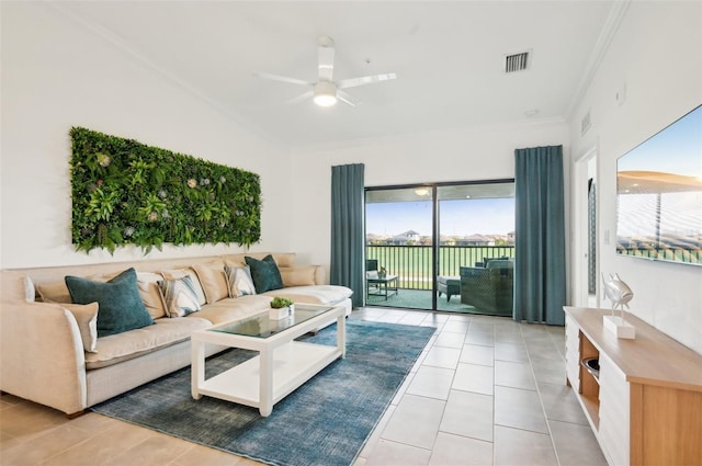 living room featuring ornamental molding, ceiling fan, and light tile patterned flooring