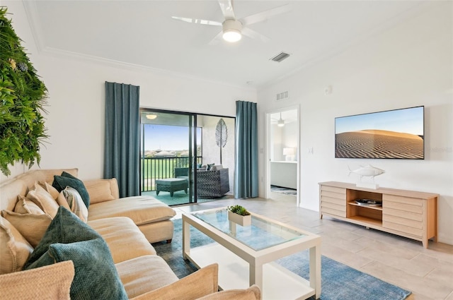 tiled living room featuring ceiling fan and ornamental molding