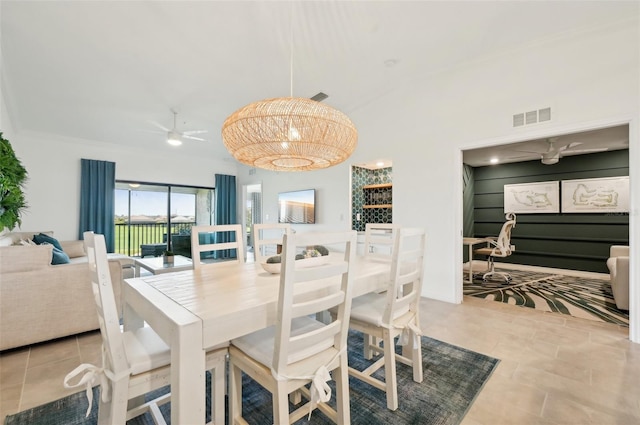 tiled dining room with ceiling fan