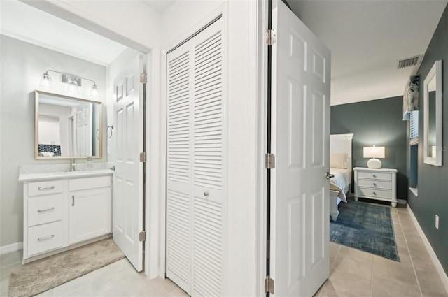 bathroom with vanity and tile patterned floors