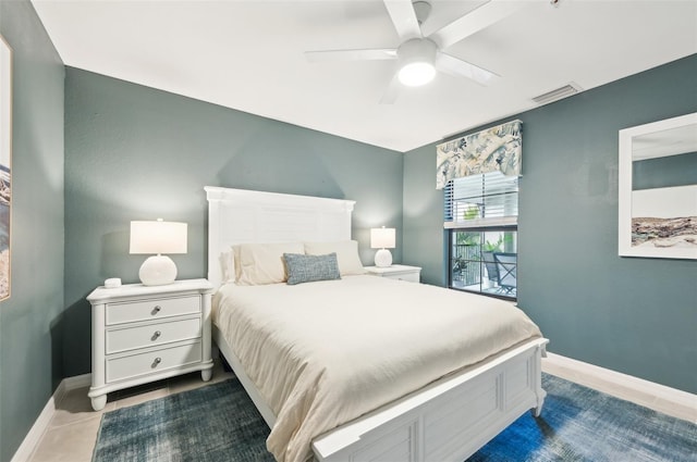 bedroom featuring ceiling fan and tile patterned flooring