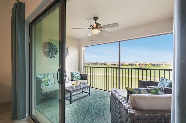 sunroom / solarium with ceiling fan