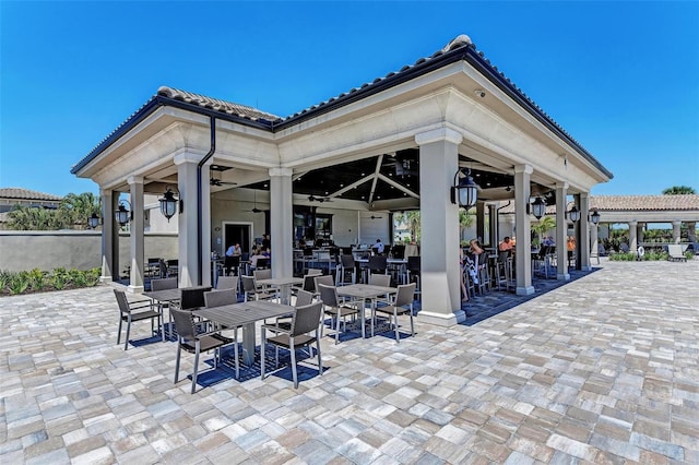 view of patio featuring ceiling fan