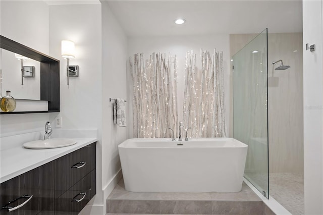 bathroom featuring vanity and plus walk in shower