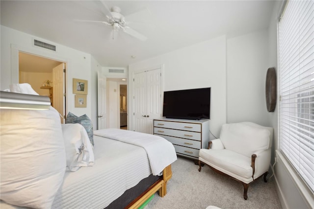 carpeted bedroom with ceiling fan