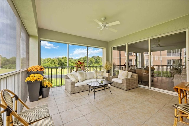 sunroom / solarium featuring ceiling fan