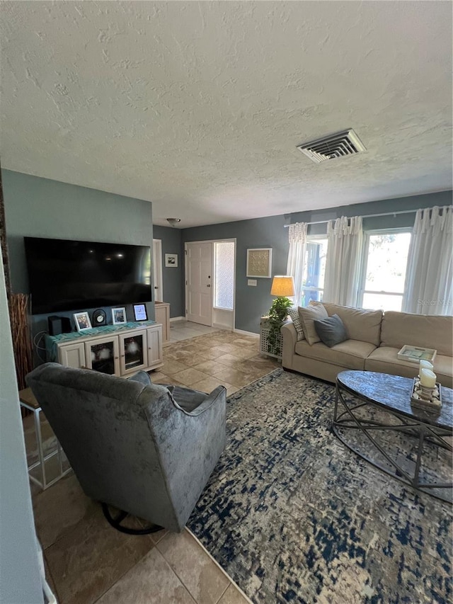 living room with a textured ceiling