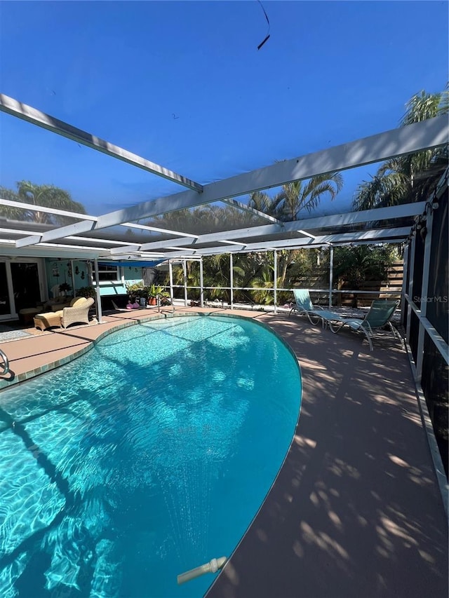 view of pool featuring a lanai and a patio