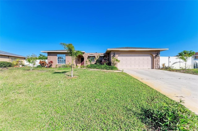 ranch-style house featuring a garage and a front yard