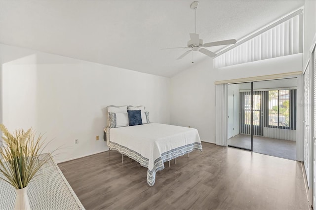 bedroom featuring lofted ceiling, access to exterior, hardwood / wood-style flooring, and ceiling fan