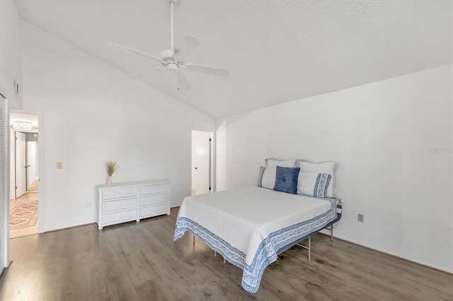 bedroom featuring hardwood / wood-style flooring, high vaulted ceiling, and ceiling fan