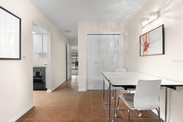 dining area with tile patterned flooring