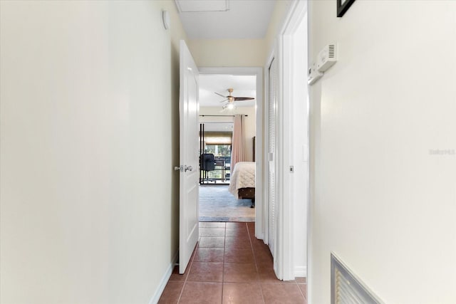 corridor featuring tile patterned floors