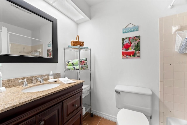 bathroom with vanity, tile patterned floors, and toilet