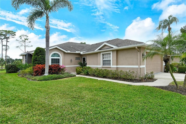 ranch-style house with a garage and a front yard